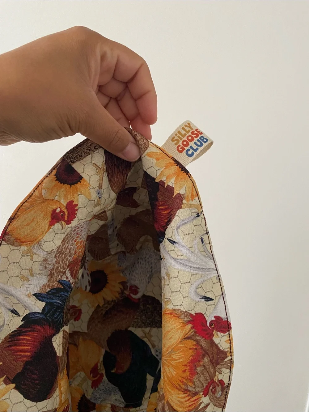 Embroidered Holland Chicken reversible bucket hat.